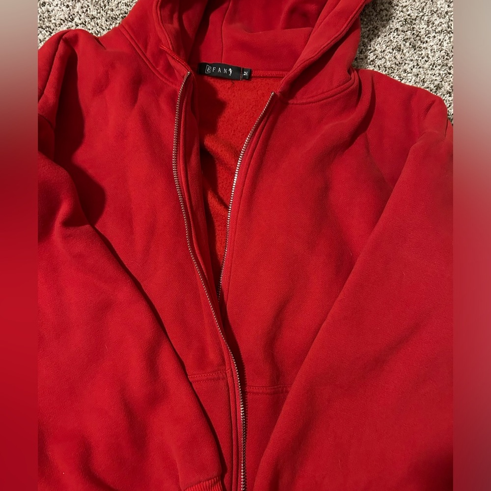 red zip up